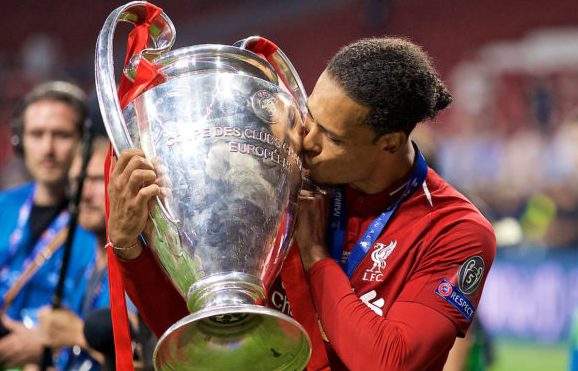 MADRID, SPAIN - SATURDAY, JUNE 1, 2019: Liverpool's Virgil van Dijk kisses the trophy after the UEFA Champions League Final match between Tottenham Hotspur FC and Liverpool FC at the Estadio Metropolitano. Liverpool won 2-0 to win their sixth European Cup. (Pic by David Rawcliffe/Propaganda)