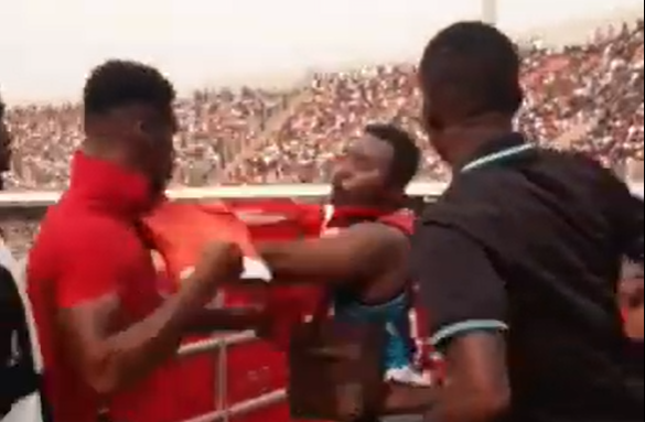 Patrick Allotey draws back his fist preparing to hit the fan