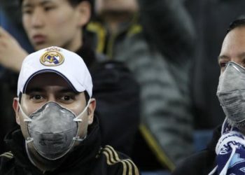 Real Madrid fans wear masks at a recent game at the Bernabeu (Image credit: Getty Images)