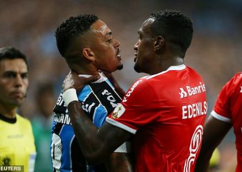 Lucio (left) and Edenilson (right) clashed as Gremio-Internacional descended into a mass brawl