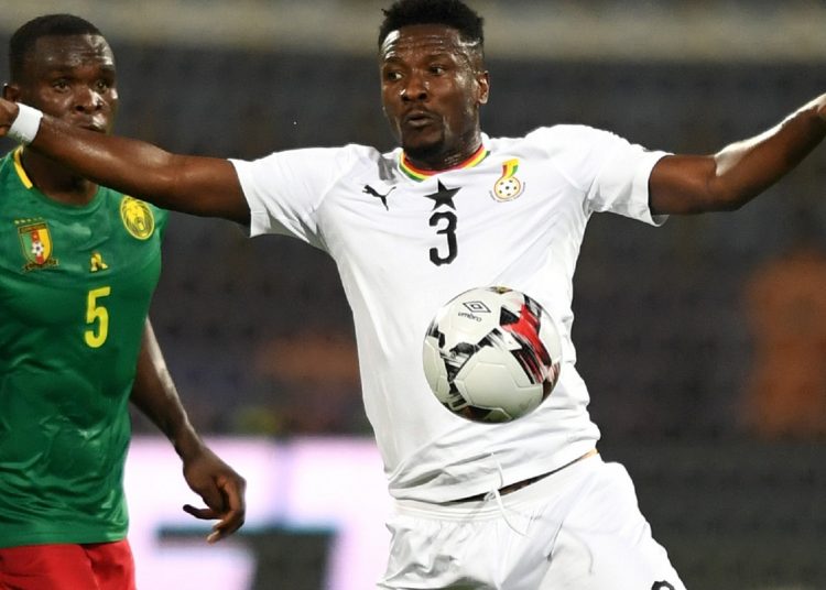 Ghana's forward Asamoah Gyan (R) controls the ball during the 2019 Africa Cup of Nations (CAN) Group F football match between Cameroon and Ghana at the Ismailia Stadium on June 29, 2019. (Photo by OZAN KOSE / AFP)        (Photo credit should read OZAN KOSE/AFP/Getty Images)