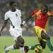 Ghana's Asamoah Gyan fights for the ball with Daouda Jabi (R) of Guinea 20 January 2008 in Accra during their 2008 African Cup of Nations match. Ghana won 2-1.   AFP/PHOTO/ABDELHAK SENNA (Photo credit should read ABDELHAK SENNA/AFP/Getty Images)