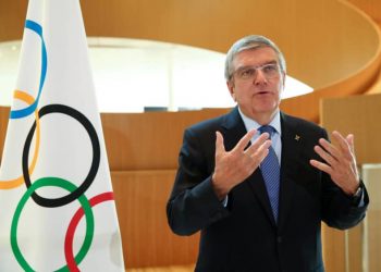 FILE PHOTO: Thomas Bach, President of the International Olympic Committee (IOC) attends an interview after the decision to postpone the Tokyo 2020 because of the coronavirus disease (COVID-19) outbreak, in Lausanne, Switzerland, March 25, 2020. REUTERS/Denis Balibouse/File Photo
