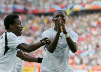 COLOGNE, GERMANY - JUNE 17:  Sulley Muntari (11) of Ghana celebrates with team mate Derek Boateng (9) afetr scoring the second goal of the game during the FIFA World Cup Germany 2006 Group E match between Czech Republic and Ghana at the Stadium Colonge on June 17, 2006 in Colonge, Germany.  (Photo by Jamie McDonald/Getty Images)