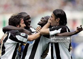 TURIN, ITALY:  Juventus Alessandro Del Piero (L), Lilian Thuram and Adrian Mutu celebrate Stephen Appiah (C) after he scored a third goal against Cagliari during the last  Serie A football match of the season in Turin's Delle Alpi Stadium 29 May 2005. AFP PHOTO/ Filippo MONTEFORTE  (Photo credit should read FILIPPO MONTEFORTE/AFP via Getty Images)