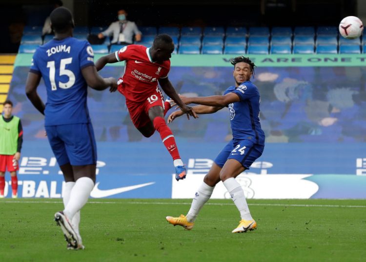 Liverpool's Senegalese striker Sadio Mane (C) heads the ball to score during the English Premier League football match between Chelsea and Liverpool at Stamford Bridge in London on September 20, 2020. (Photo by Matt Dunham / POOL / AFP) / RESTRICTED TO EDITORIAL USE. No use with unauthorized audio, video, data, fixture lists, club/league logos or 'live' services. Online in-match use limited to 120 images. An additional 40 images may be used in extra time. No video emulation. Social media in-match use limited to 120 images. An additional 40 images may be used in extra time. No use in betting publications, games or single club/league/player publications. /  (Photo by MATT DUNHAM/POOL/AFP via Getty Images)