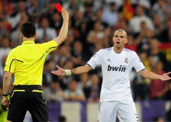 Real Madrid's Pepe from Portugal is shown a red card by the referee during their semifinal first leg Champions League soccer match against FC Barcelona at the Bernabeu stadium in Madrid, Spain, Wednesday, April 27, 2011. (AP Photo/Manu Fernandez)