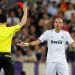 Real Madrid's Pepe from Portugal is shown a red card by the referee during their semifinal first leg Champions League soccer match against FC Barcelona at the Bernabeu stadium in Madrid, Spain, Wednesday, April 27, 2011. (AP Photo/Manu Fernandez)