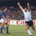 (FILES) In this file photo taken on July 03, 1990 Argentinian forward Diego Maradona (R) celebrates after teammate Claudio Caniggia (not pictured) tied the score at 1 during the World Cup semifinal soccer match between Italy and Argentina in Naples. - Argentinian football legend Diego Maradona passed away on November 25, 2020. (Photo by DANIEL GARCIA / AFP)