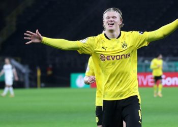 DORTMUND, GERMANY - FEBRUARY 02: Erling Haaland of Borussia Dortmund celebrates after scoring their side's third goal during the DFB Cup Round of Sixteen match between Borussia Dortmund and SC Paderborn 07 at Signal Iduna Park on February 02, 2021 in Dortmund, Germany. Sporting stadiums around Germany remain under strict restrictions due to the Coronavirus Pandemic as Government social distancing laws prohibit fans inside venues resulting in games being played behind closed doors. (Photo by Friedemann Vogel - Pool/Getty Images)