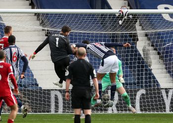 WEST BROMWICH, ENGLAND - MAY 16: Goalkeeper Alisson Becker of Liverpool scores a goal to make it 1-2 during the Premier League match between West Bromwich Albion and Liverpool at The Hawthorns on May 16, 2021 in West Bromwich, United Kingdom. (Photo by Adam Fradgley - AMA/West Bromwich Albion FC via Getty Images)
