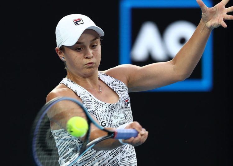 MELBOURNE, AUSTRALIA - JANUARY 23: Ashleigh Barty of Australia plays a forehand in her fourth round singles match against Amanda Anisimova of United States during day seven of the 2022 Australian Open at Melbourne Park on January 23, 2022 in Melbourne, Australia. (Photo by Mark Metcalfe/Getty Images)