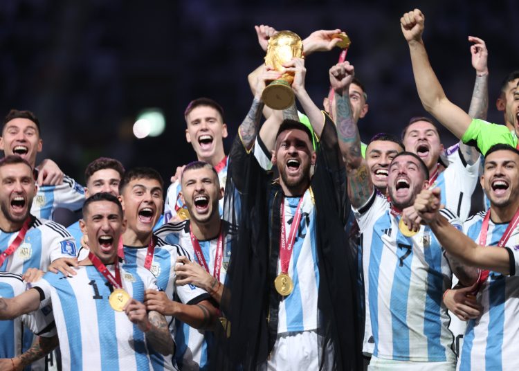 MESSI LIFTS WORLD CUP TROPHY
