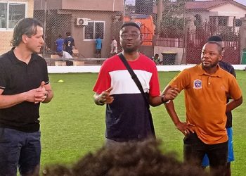 Addo speaks with Attram De Visser players after a training session
