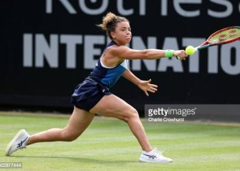 Jasmine Paolini of Italy plays a backhand against Ons Jabeur of Tunisia in the Women's Singles First Round match (Photo by Charlie Crowhurst/Getty Images for LTA)