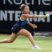 Jasmine Paolini of Italy plays a backhand against Ons Jabeur of Tunisia in the Women's Singles First Round match (Photo by Charlie Crowhurst/Getty Images for LTA)