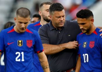 U.S. manager B.J. Callaghan consoles Cristian Roldan after losing to Panama in a shootout at the Gold Cup.