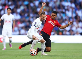 James Maddison of Tottenham Hotspur is challenged by Casemiro of Manchester United (Photo by Clive Rose/Getty Images)