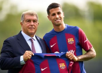 Barca President Joan Laporta with Cancelo Alex Caparros/Getty Images