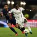 Marquinhos fights for the ball with Lyon's Ghanaian forward #37 Ernest Nuamah (Photo by JEFF PACHOUD/AFP via Getty Images)