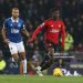 Kobbie Mainoo of Manchester United in action with Dominic Calvert-Lewin of Everton (Photo by Matthew Peters/Manchester United via Getty Images)