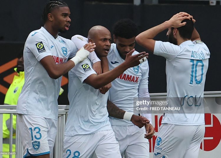 Le Havre's Ghanaian forward #28 Andre Ayew (2ndL) is congratulated by his teammates (Photo by FRED TANNEAU/AFP via Getty Images)