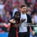 Bayer Leverkusen's Spanish coach Xabi Alonso (R) and Bayer Leverkusen's Dutch defender #30 Jeremie Frimpong (Photo by INA FASSBENDER/AFP via Getty Images)