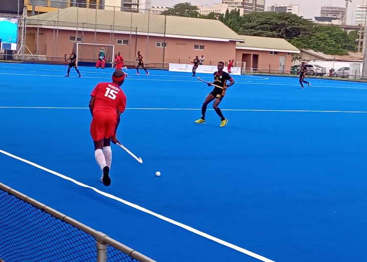 Ghana in action against Kenya (red) at 13th African Games