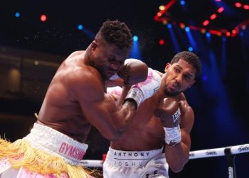 Joshua punches Ngannou Photo Courtesy: Yahoo Sports