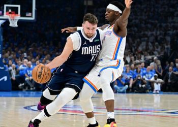 Luka Doncic is guarded by Lu Dort Photo Courtesy: Getty Images