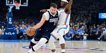 Luka Doncic is guarded by Lu Dort Photo Courtesy: Getty Images