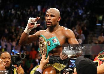 Floyd Mayweather Jr. celebrates his unanimous-decision victory over Robert Guerrero in their WBC welterweight title bout (Photo by Al Bello/Getty Images)