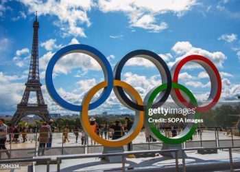 The Olympic Rings being placed in front of the Eiffel Tower Photo Courtesy: Getty Images