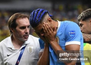 Ronald Araujo of Uruguay reacts after suffering an injury during the CONMEBOL Copa America 2024 quarterfinal match between Uruguay and Brazil (Photo by Candice Ward/Getty Images)