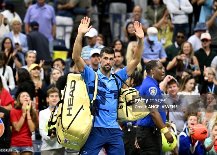 TOPSHOT - Serbia's Novak Djokovic waves at the crowd after his defeat against Australia's Alexei Popyrin during their men's singles third round match on day five of the US Open tennis tournament at the USTA Billie Jean King National Tennis Center in New York City, on August 30, 2024. (Photo by ANGELA WEISS / AFP) (Photo by ANGELA WEISS/AFP via Getty Images)