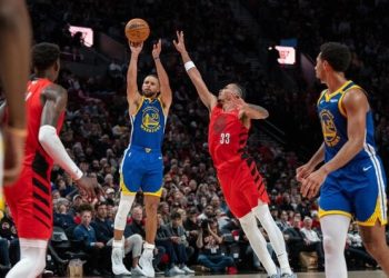 Steph Curry attempts shot against Portland Trailblazers Photo Courtesy: Stephen Brashear-Imagn Images