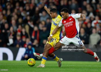 Caleb Kporha of Crystal Palace and Jurrien Timber of Arsenal challenge during the Carabao Cup Quarter Final match between Arsenal and Crystal Palace at Emirates Stadium on December 18, 2024 in London, England. (Photo by Nigel French/Sportsphoto/Allstar via Getty Images)