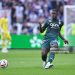 Mohammed Salisu of Monaco passes the ball during the Ligue 1 match between Olympique Lyonnais and AS Monaco at Groupama Stadium on August 24, 2024 in Lyon, France. (Photo by Franco Arland/Getty Images)