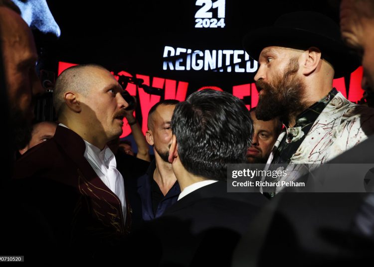 Tyson Fury (R) and Oleksandr Usyk face off ahead of the IBF, IBO, WBA, WBC and WBO Undisputed World Heavyweight Title fight (Photo by Richard Pelham/Getty Images)