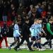 Arsenal players and coaches walk off pitch after goalless draw with Nottingham Forest Photo Courtesy: Getty Images
