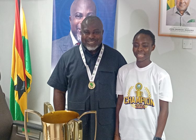 GRA Commissioner-General Anthony Sarpong with GRA Female Hockey Team Captain Elizabeth Opoku