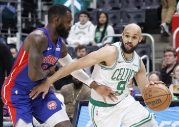 Tim Hardaway Jr. guards Derrick White Photo Courtesy: AP