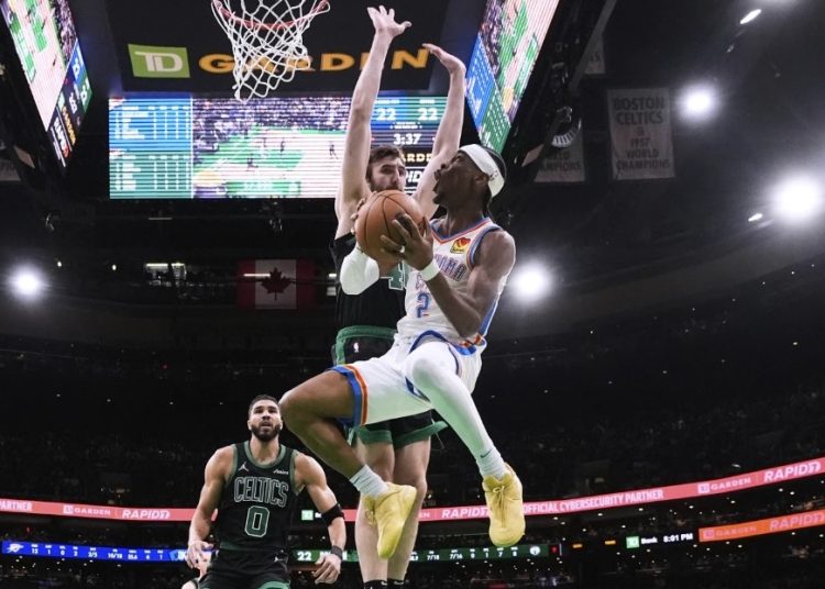 Shai Gilgeous-Alexander attempts layup against Celtics Photo Courtesy: AP