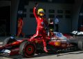 Ferrari's British driver Lewis Hamilton waves as he gets out of his car to celebrate taking pole position after the sprint qualifying session of the Formula One Chinese Grand Prix (Photo by GREG BAKER/AFP via Getty Images)