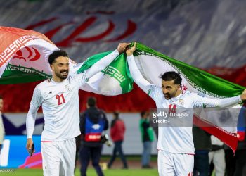 Iran's players #21 Omid Norafkan and #14 Saman Ghoddos (Photo by -/AFP via Getty Images)