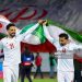 Iran's players #21 Omid Norafkan and #14 Saman Ghoddos (Photo by -/AFP via Getty Images)