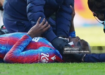 Jean-Philippe Mateta of Crystal Palace receives medical treatment after being fouled in a tackle with Liam Roberts of Millwall (Photo by Crystal Pix/MB Media/Getty Images)