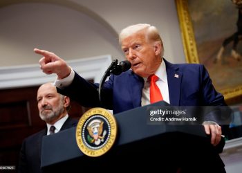 U.S. President Donald Trump, accompanied by Commerce Secretary Howard Lutnick (L)(Photo by Andrew Harnik/Getty Images)