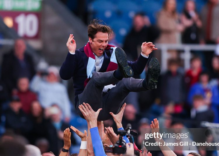 Burnley players celebrate promotion by throwing Scott Parker, manager of Burnley, into the air (Photo by James Gill - Danehouse/Getty Images)