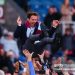 Burnley players celebrate promotion by throwing Scott Parker, manager of Burnley, into the air (Photo by James Gill - Danehouse/Getty Images)